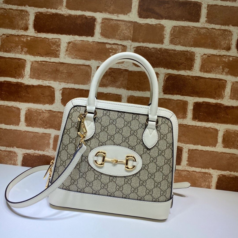 G*u*i top handle bags